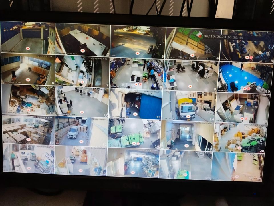 CCTV monitor grid covering factory production and warehouse areas